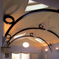 based on a boat shed, with rolled ‘t’ trusses and concealed lighting on alternate corbels