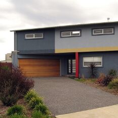 a strong street presence with minimal south glazing gives privacy and energy efficiency