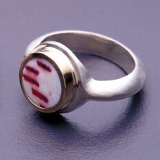 a ring made from shell, 18K gold and brushed sterling silver