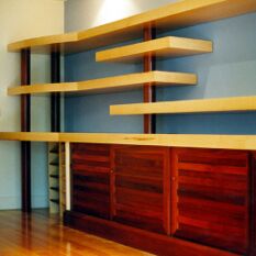 a custom commissioned piece of furniture using pale maple veneer and solid redgum